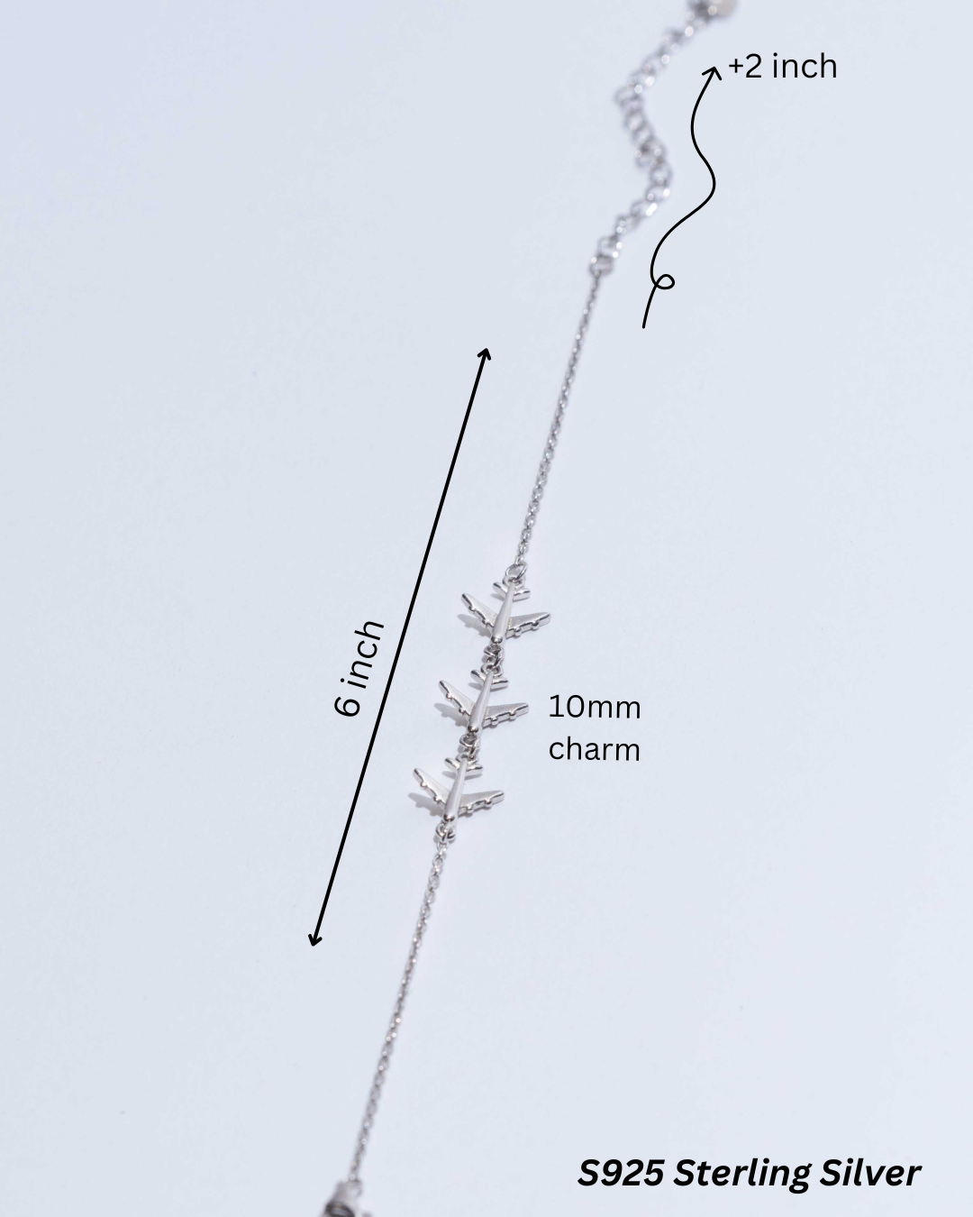 Silver Bracelet with Three Airplanes: A close-up view of the delicate yet striking bracelet, perfect for every traveler.