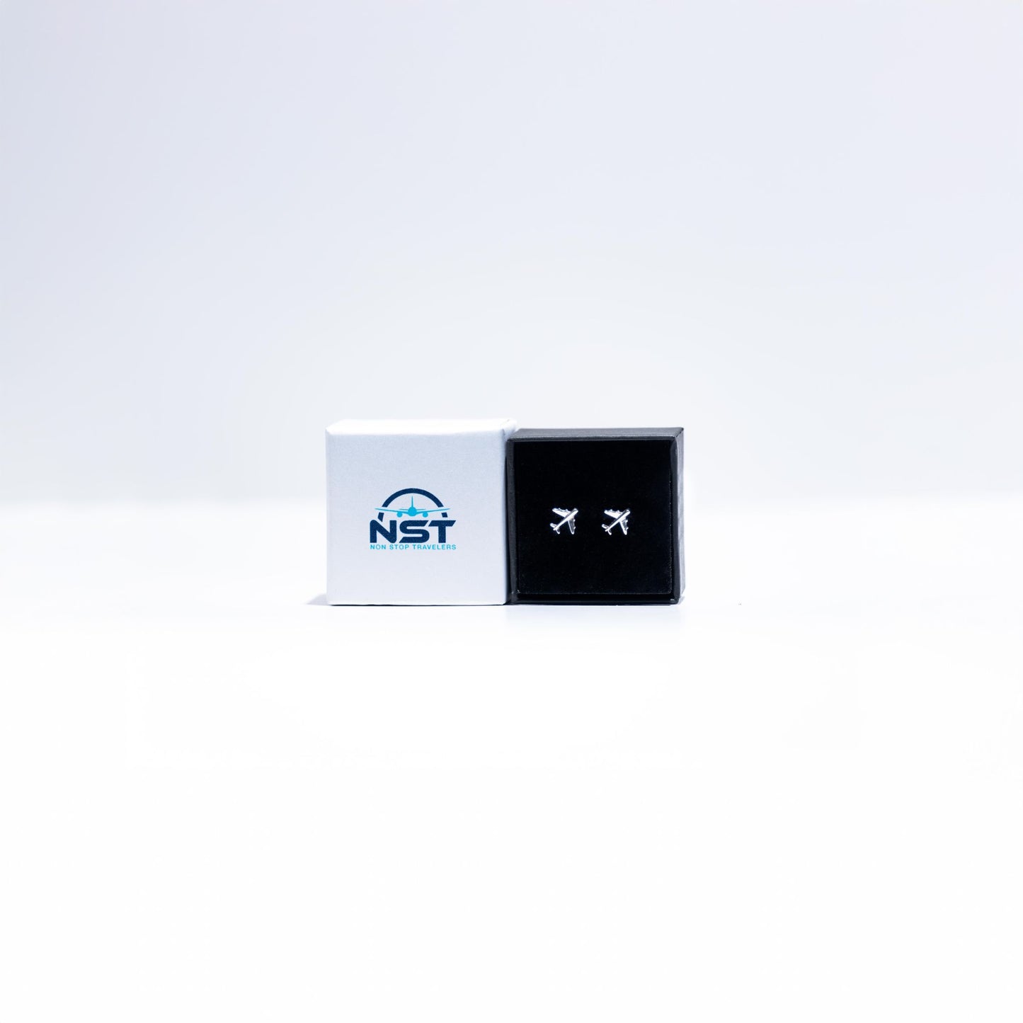 Sterling silver airplane earrings, approximately 10mm, packaged for safekeeping. A thoughtful gift for travel enthusiasts.